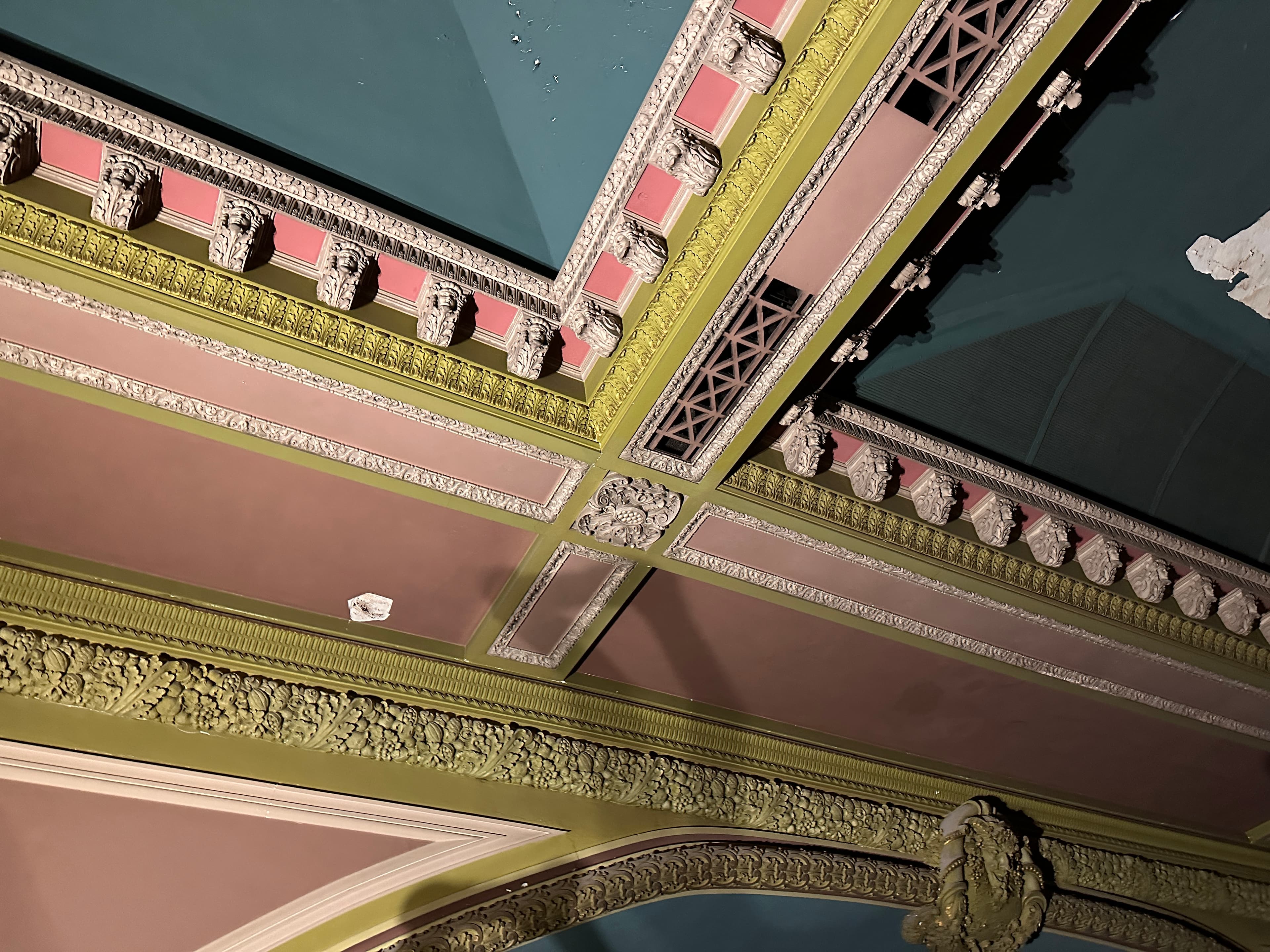 A close-up of the original ornate plaster ceiling ornament inside the Coliseum Theatre
