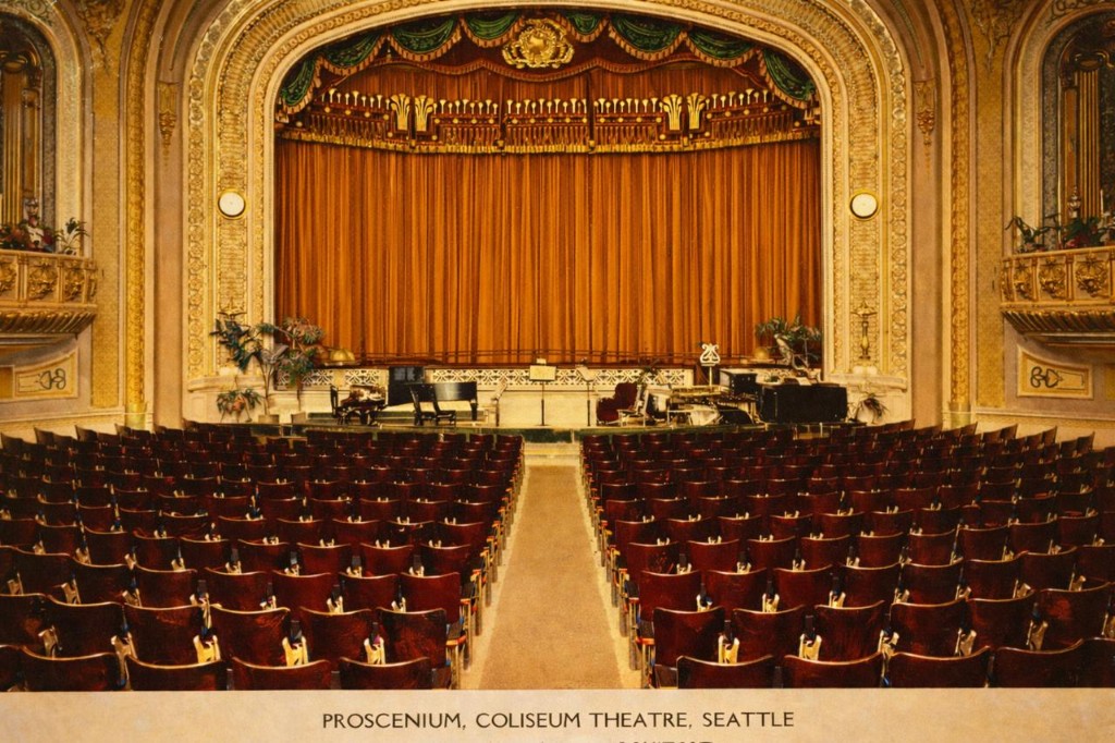 Hand-tinted postcard of the Coliseum proscenium in warm gold and orange